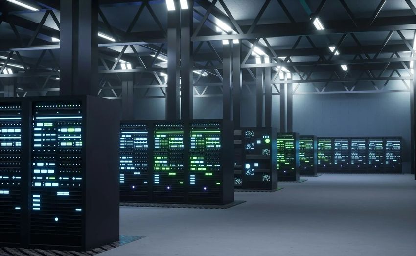 Rows of glowing server racks in a dim data center with blue and green lights