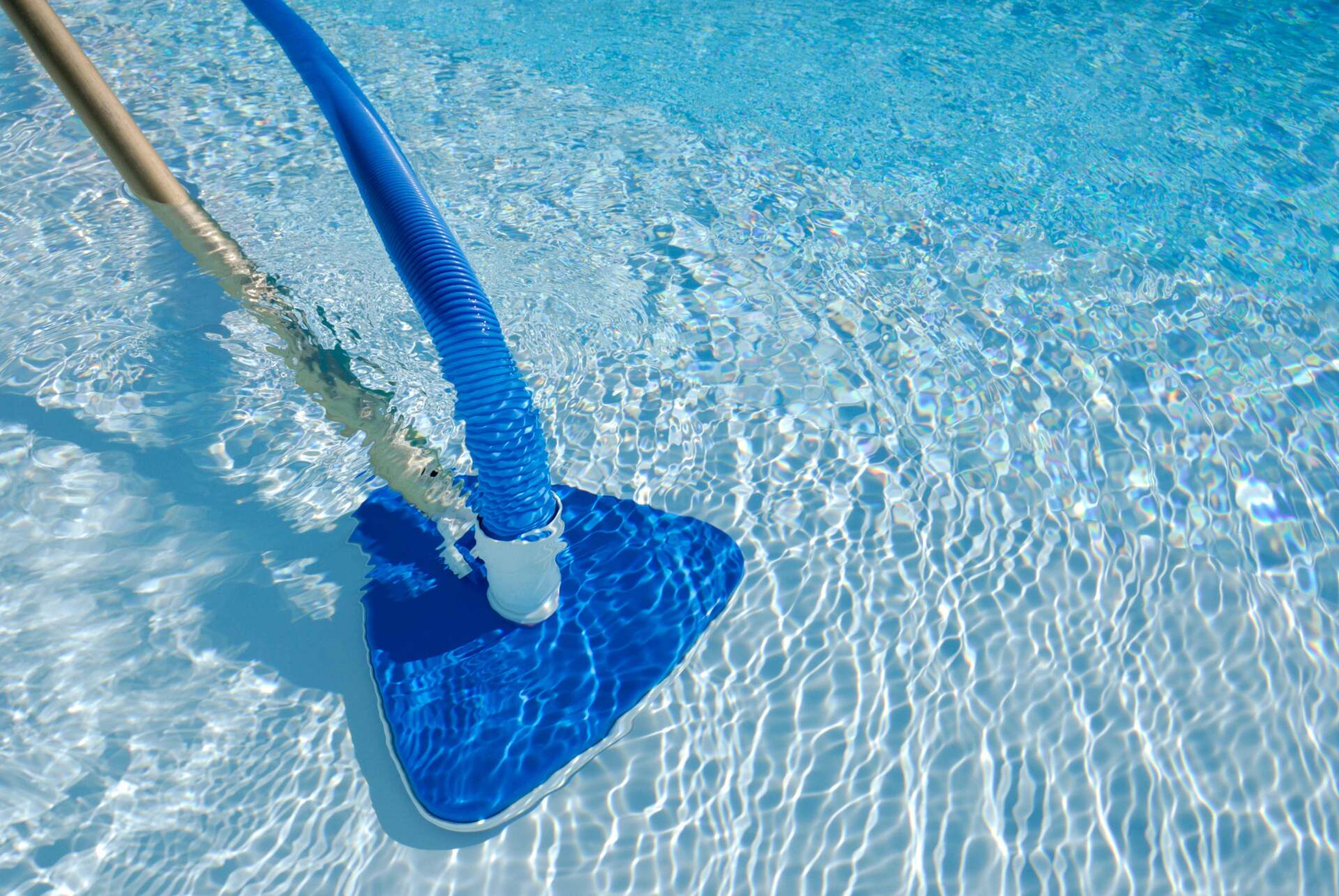 Cleaning a Swimming Pool Using a Pool Hoover — Wilmington, NC — Absolute Pool Solution LLC