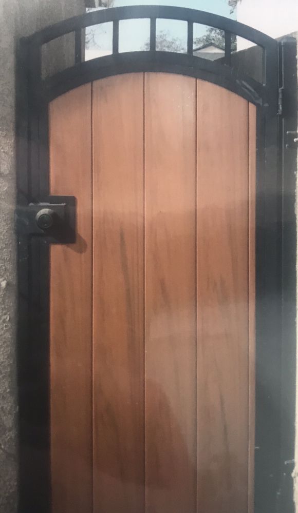 Classic Iron Gate with a Brick Wall