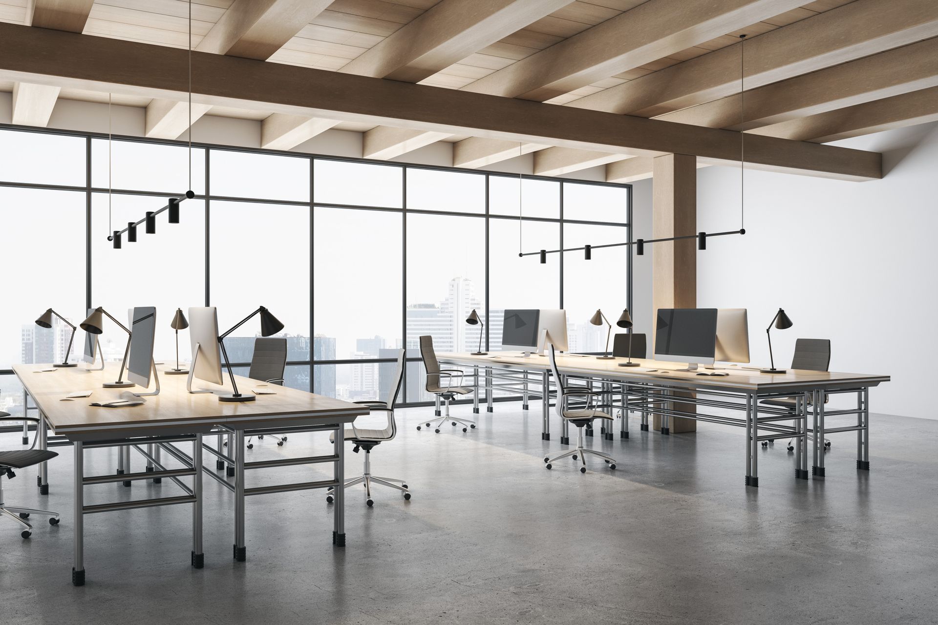 An empty office with a lot of windows and tables and chairs