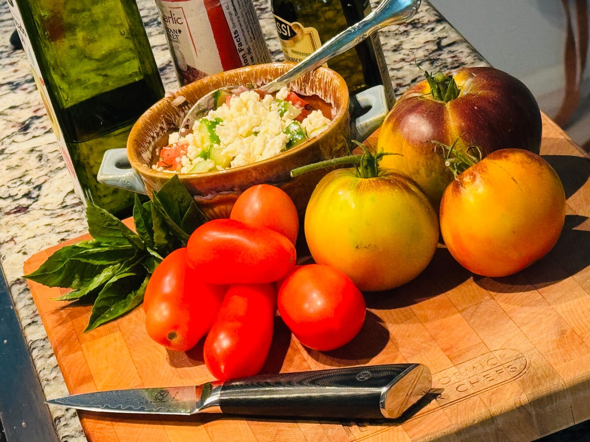 Heirloom tomatoes, cucumbers and basil for a lovely summer salad.