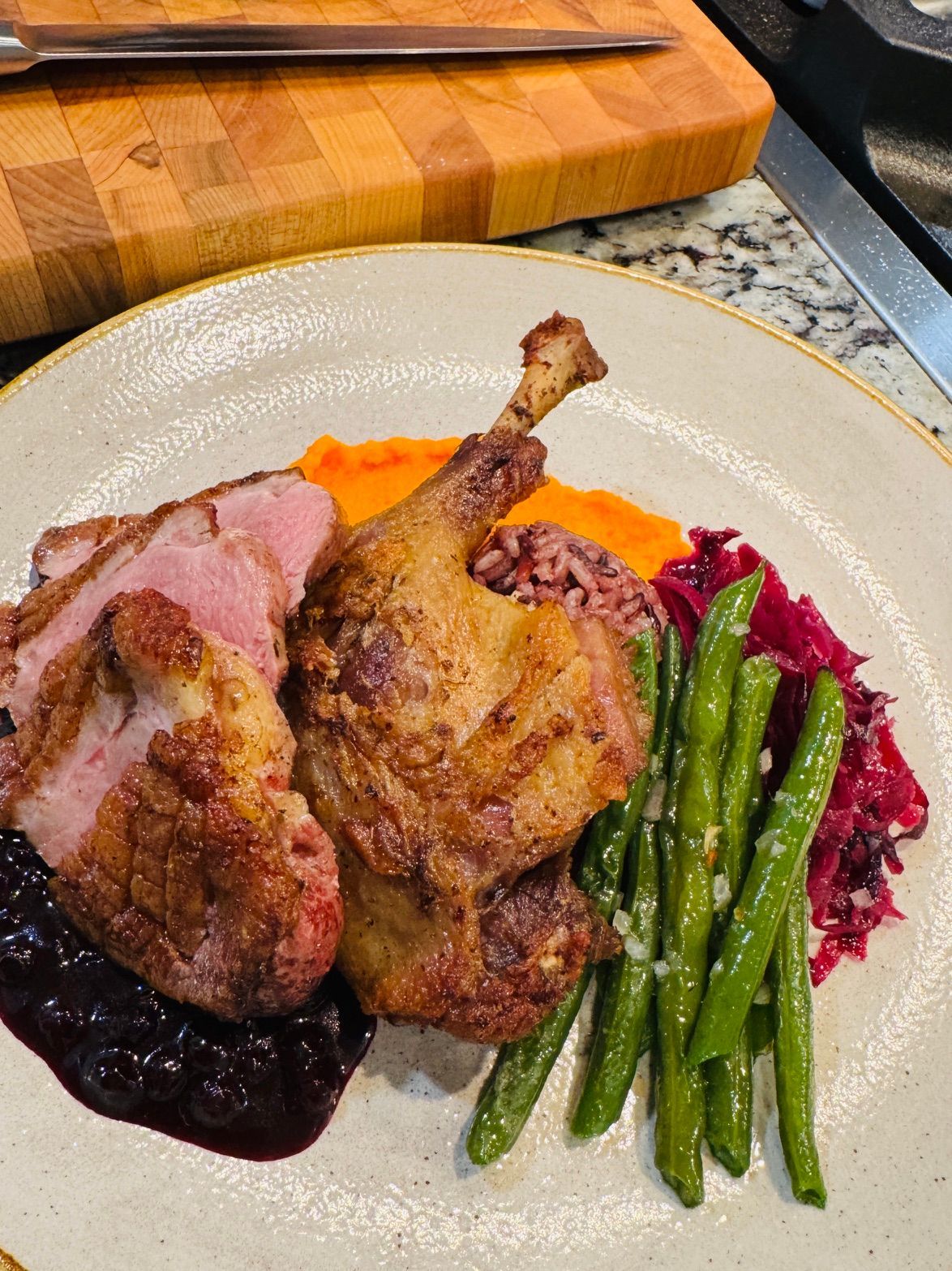 Duck prepared in two ways. Duck leg confit and sauteed duck breast with huckleberries.