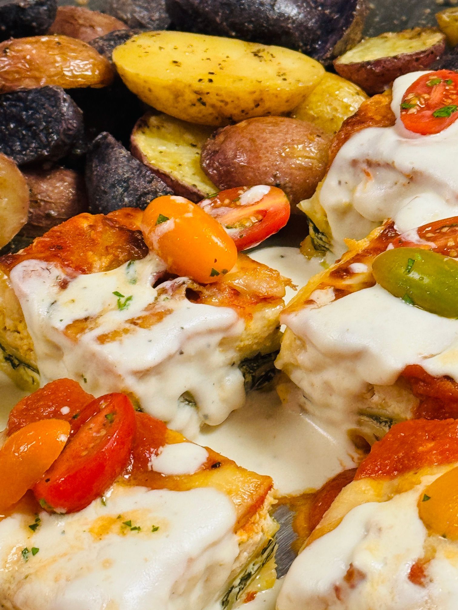 Smoked chicken lasagna with two sauces.