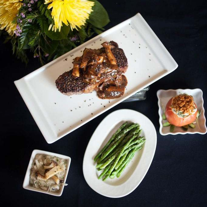 Strip steak with steak house sides