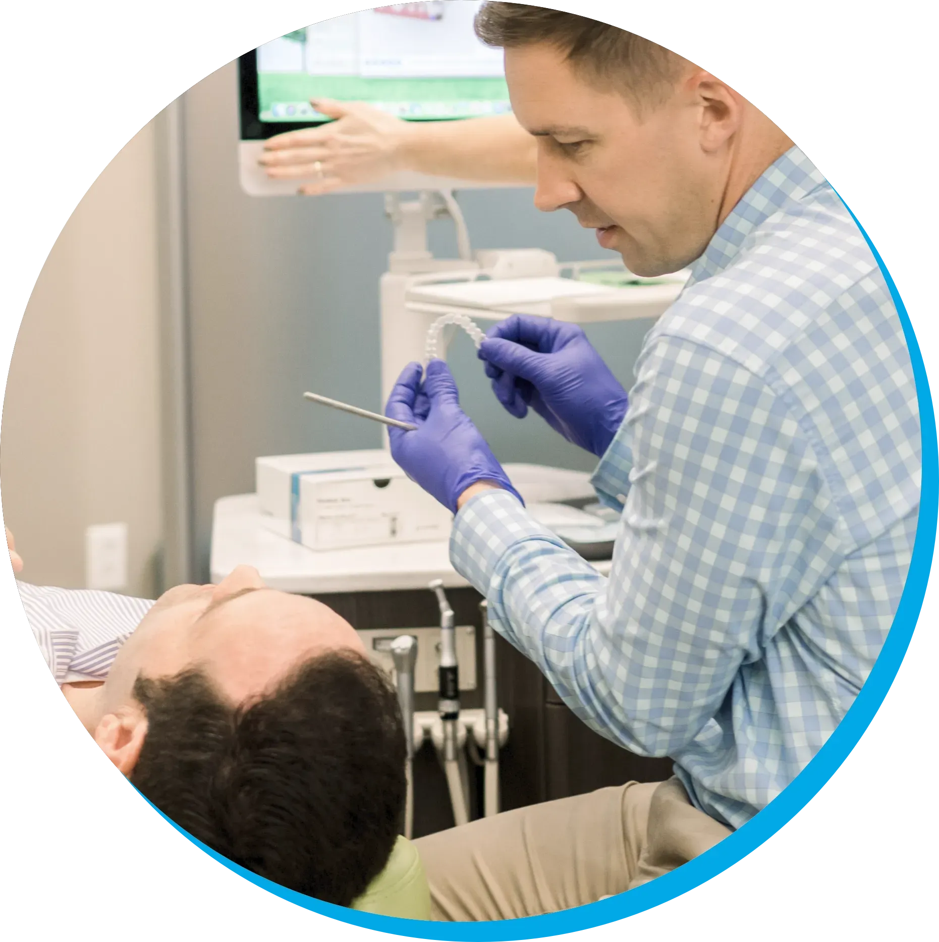 A man is getting his teeth examined by a dentist
