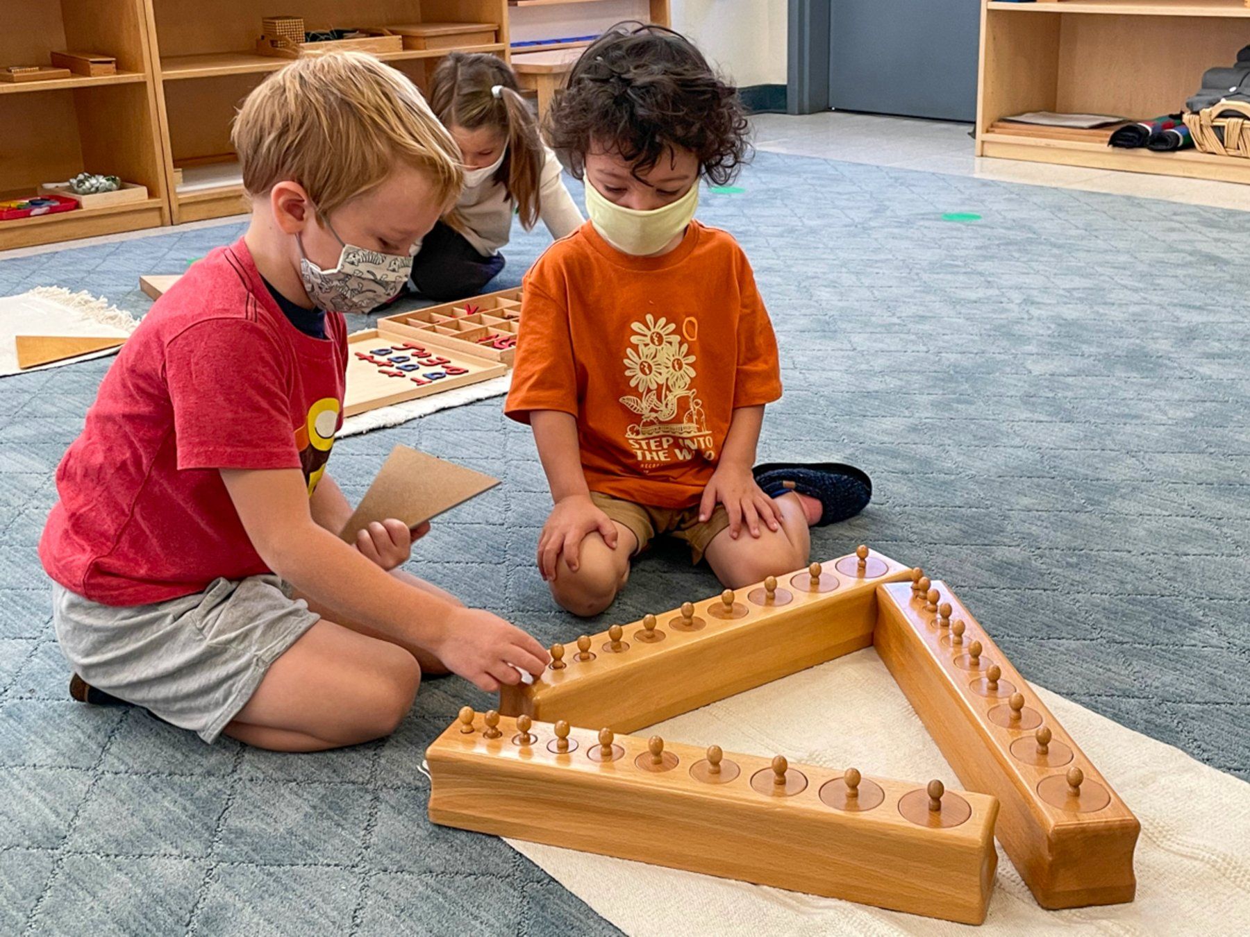 Primary Student Working with the Knobbed Cylinders