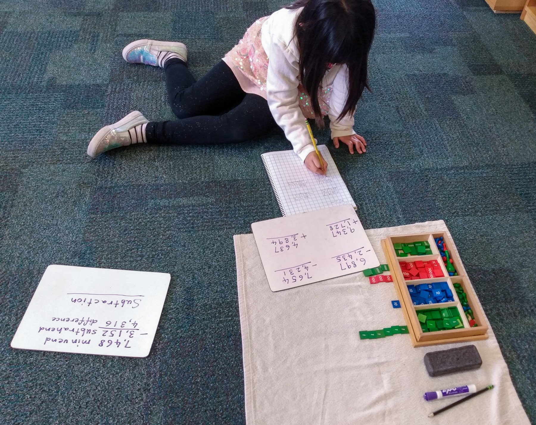 Upper Elementary student working with the stamp game