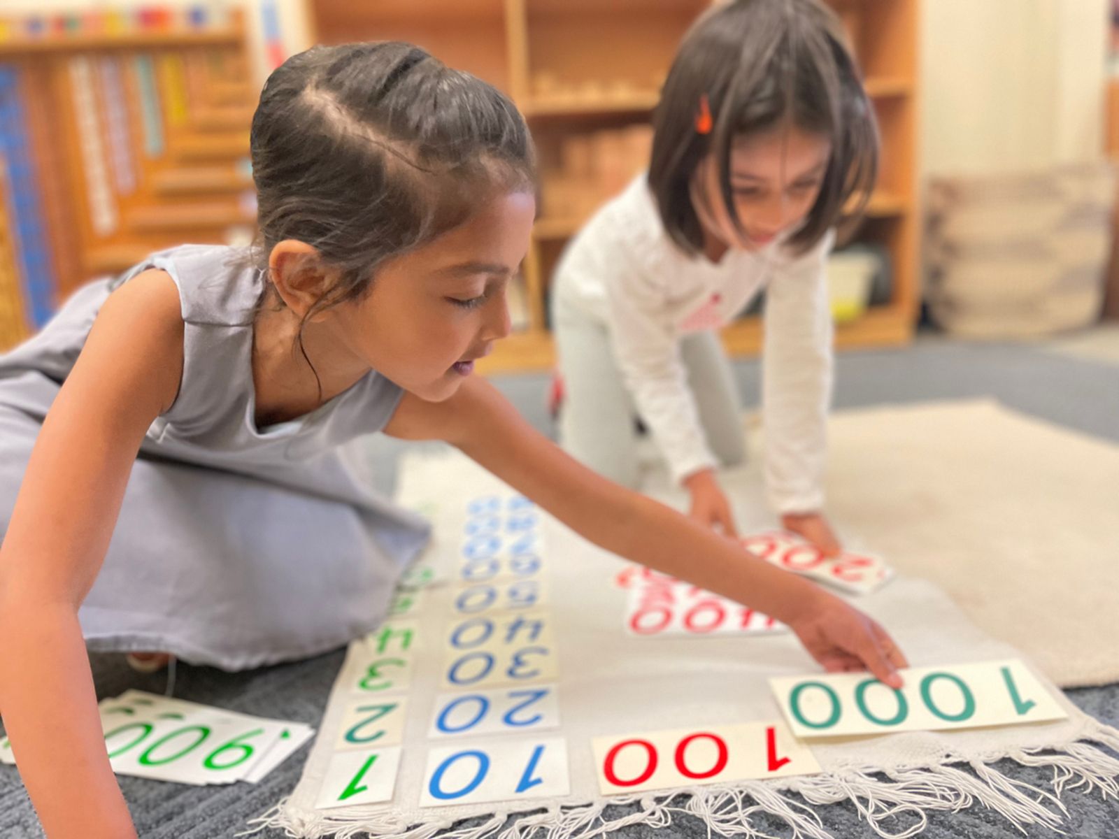 Primary student working with the red and blue bars