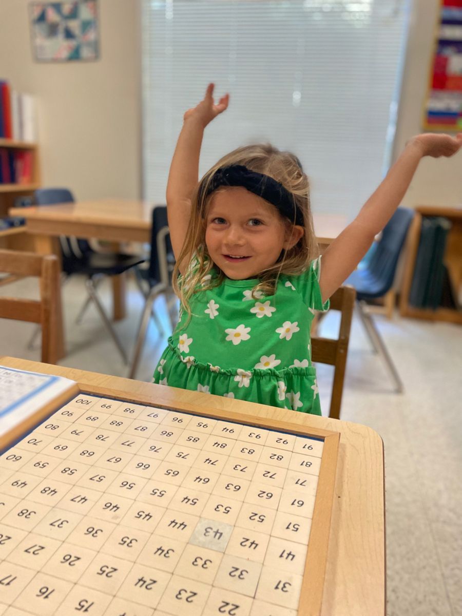 Montessori child working with math materials