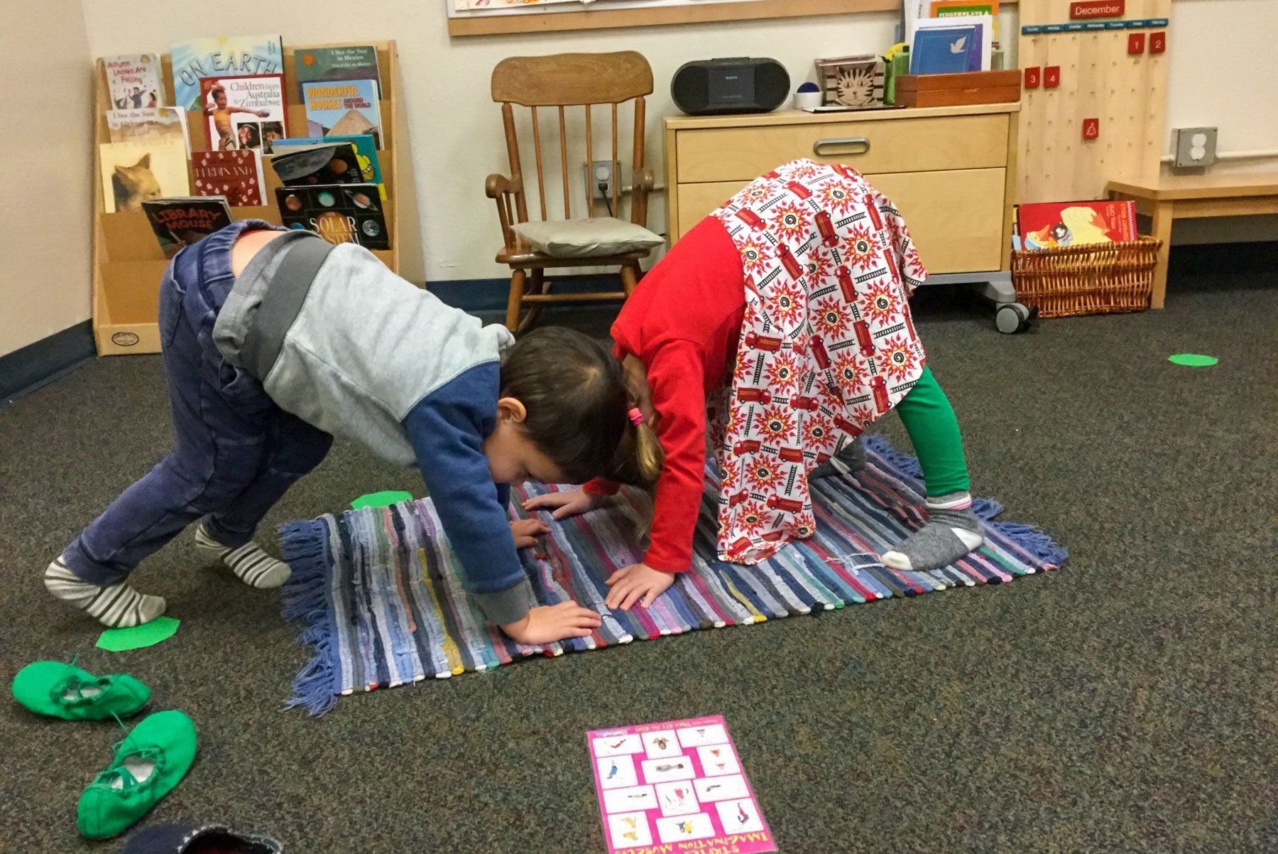 Primary students practicing yoga