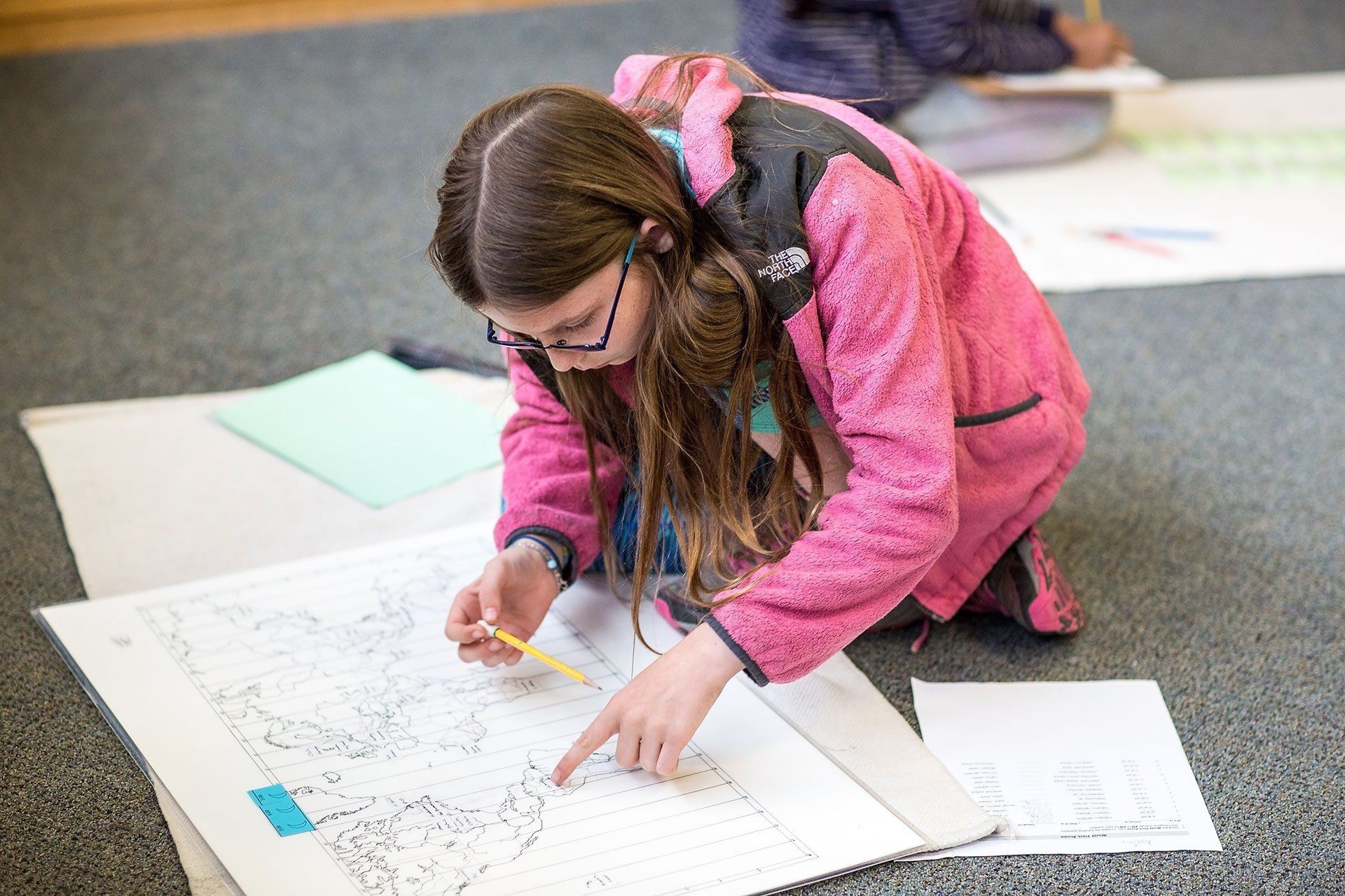Upper elementary student working on geography