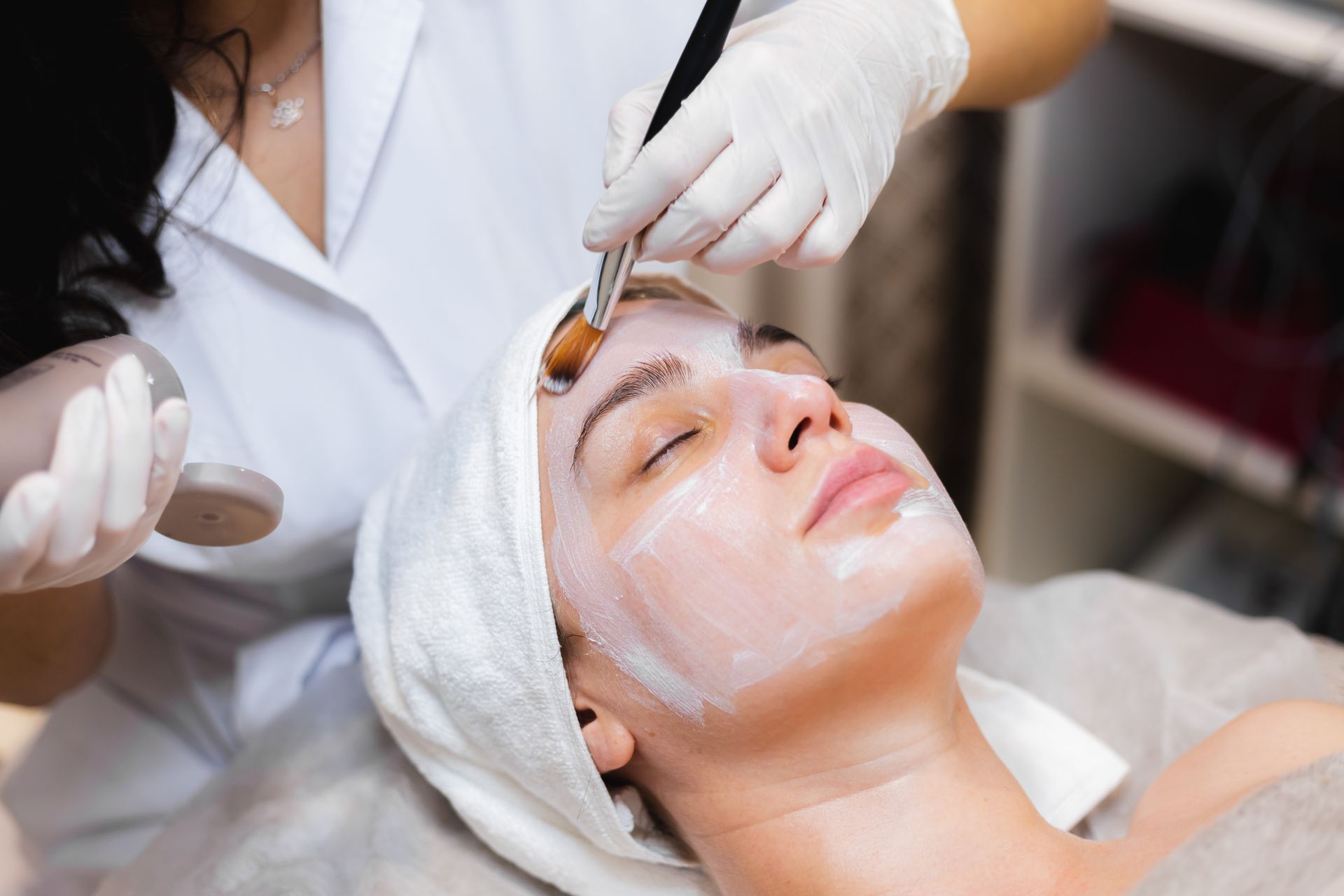 woman receiving facial treatment procedure