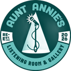 Round teal logo: "Aunt Annie's Listening Room & Gallery." A microphone and needle within a spotlight. "Re-Est. 2026."