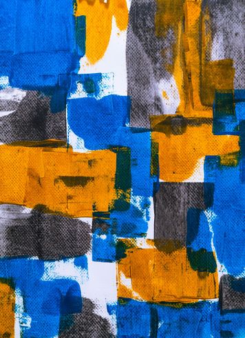 Abstract pattern with blue, yellow, and gray brushstrokes on a white background.