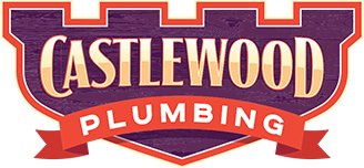 Logo for Castlewood Plumbing, featuring text on a shield shape with a castle top and ribbon banner.