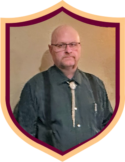 Portrait of a man in a dark shirt, framed in a gold-and-burgundy shield border