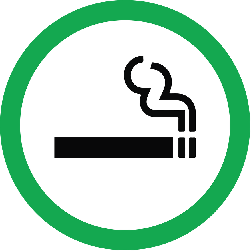 A green circular sign containing a black icon of a lit cigarette with rising smoke, indicating a smoking area.