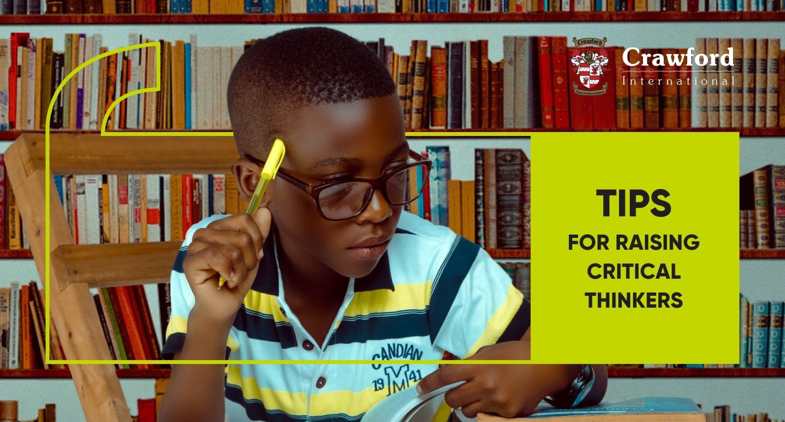 A young boy is sitting in a chair in front of a bookshelf in a library.