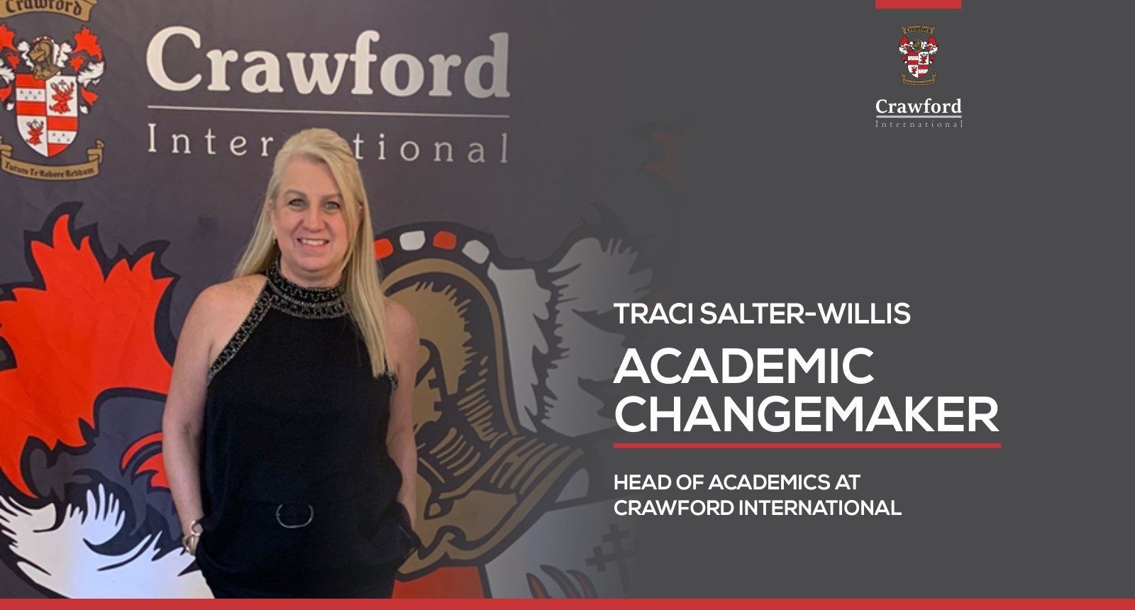 A woman is standing in front of a crawford international banner