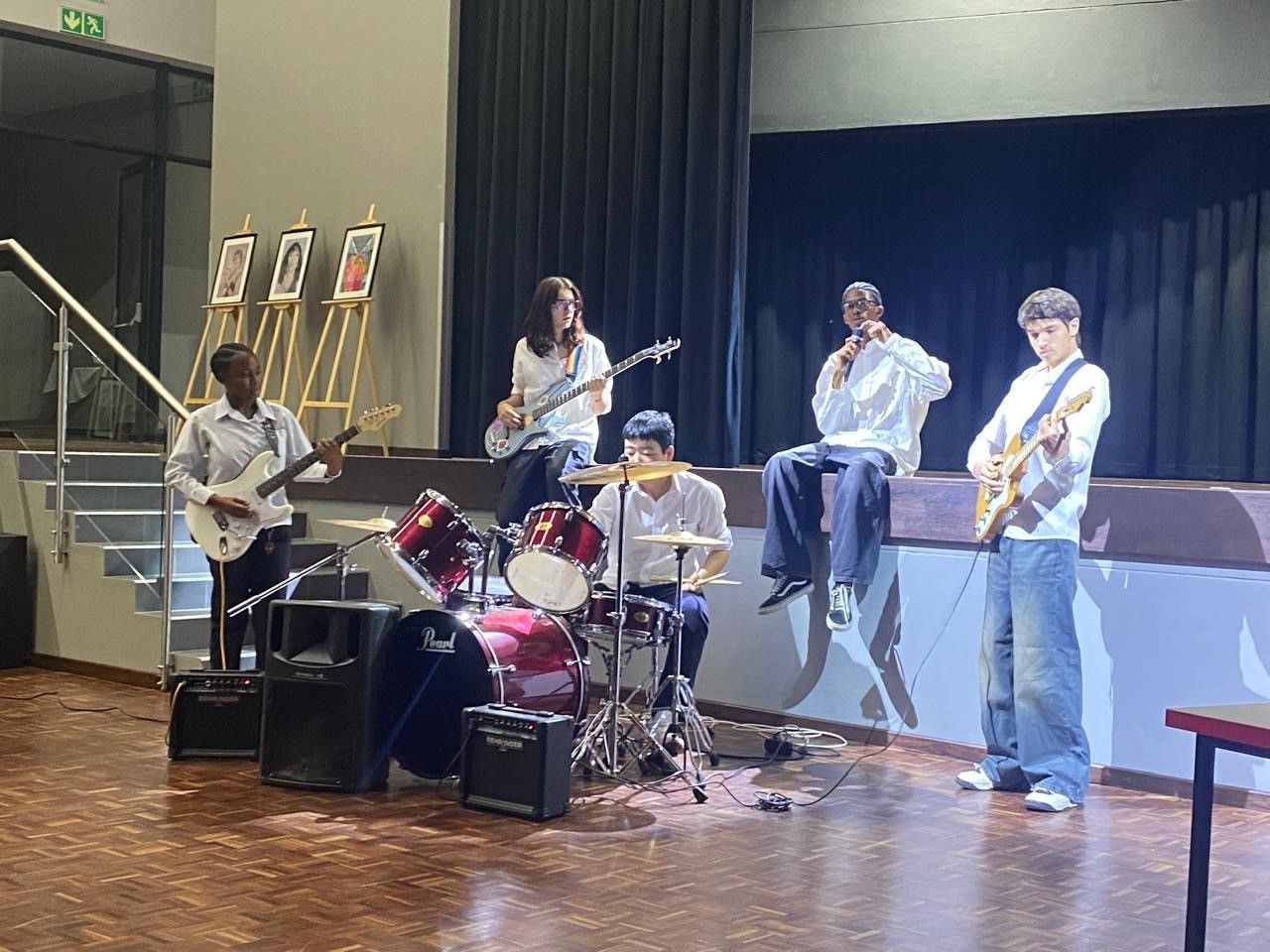 A group of people are playing instruments on a stage.