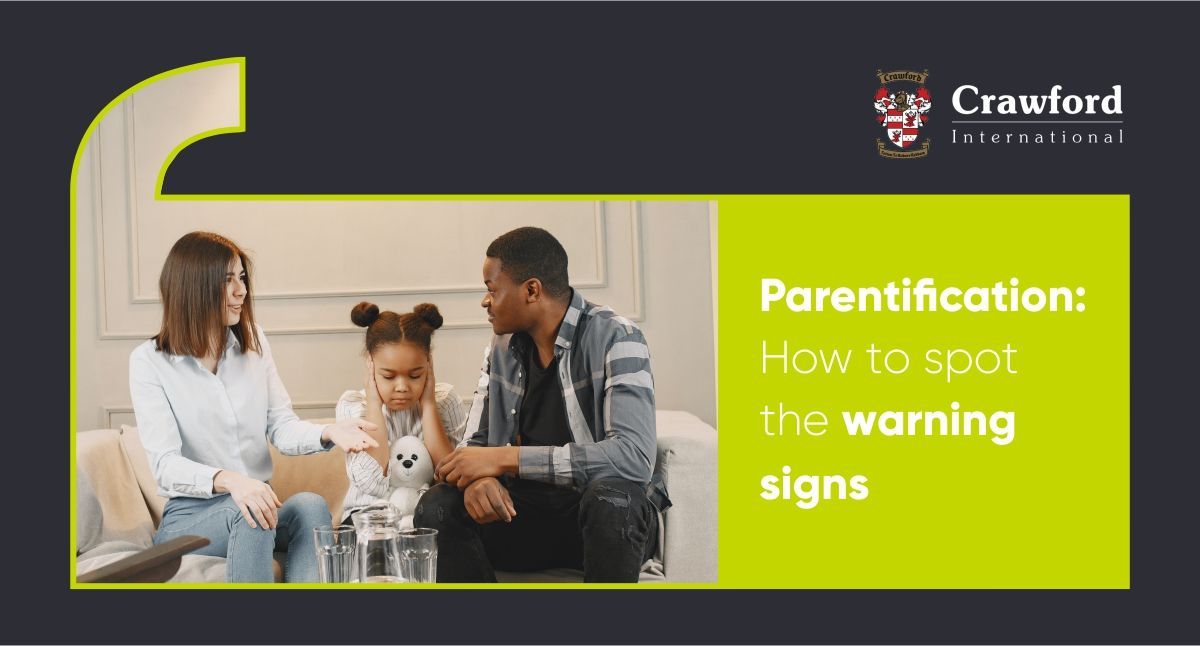 A man and a woman are sitting on a couch with a child.