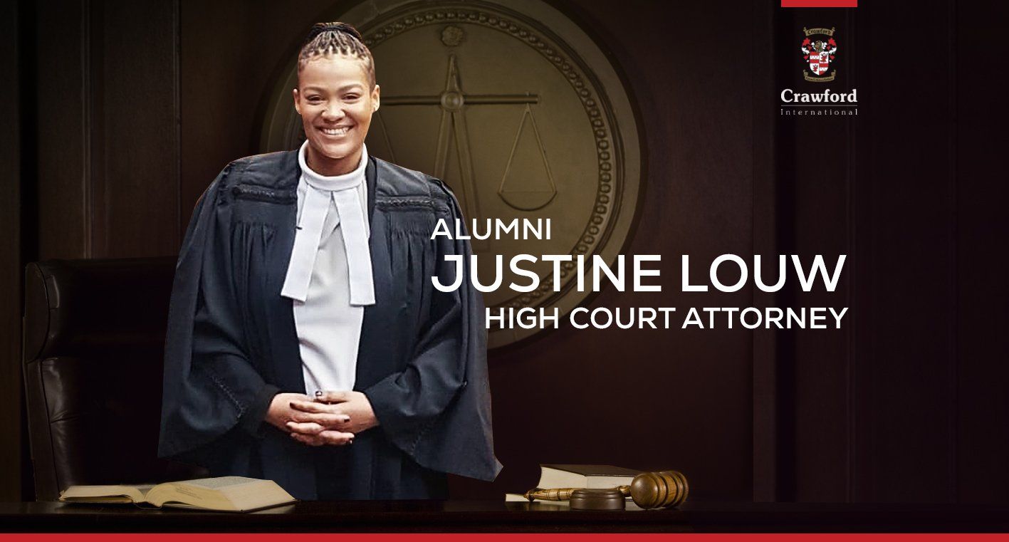 A woman in a courtroom dressed as a high court attorney.