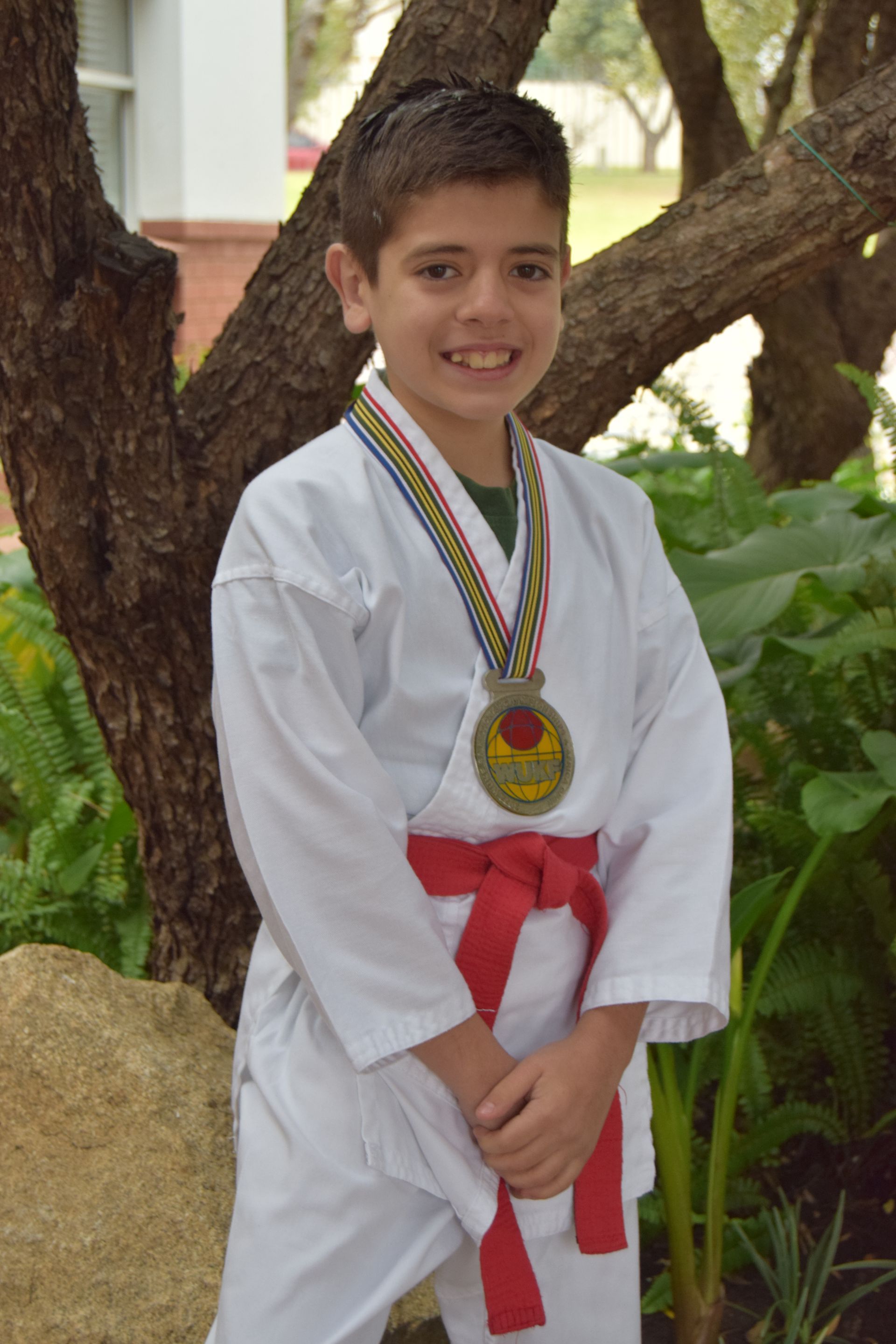 Child with martial arts medal