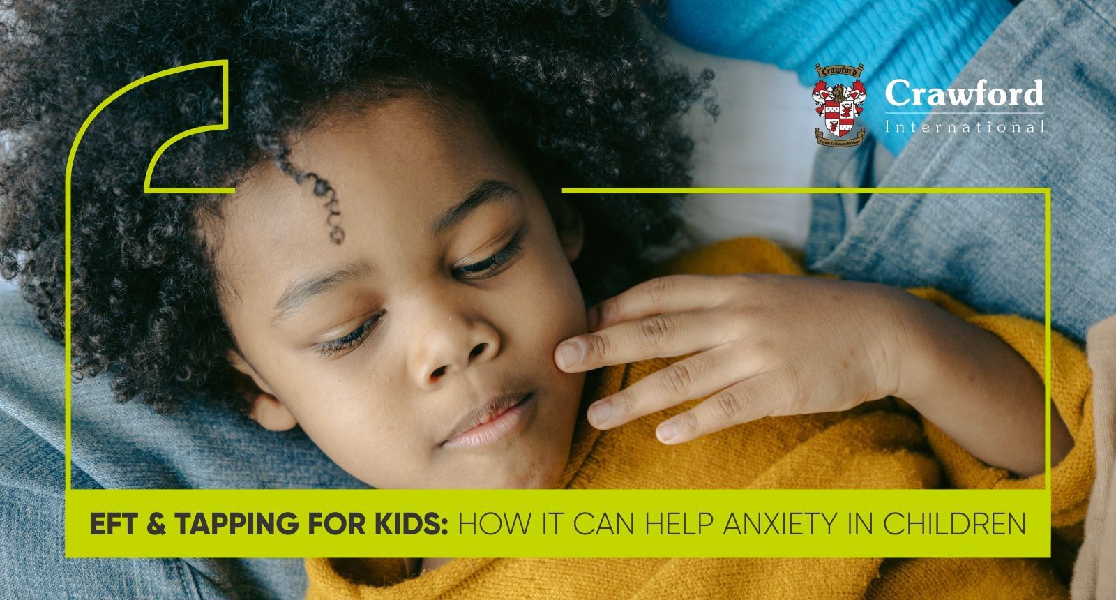 A little girl is laying on a bed with her eyes closed.