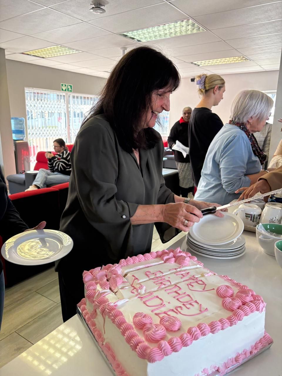 Woman cutting cake, 