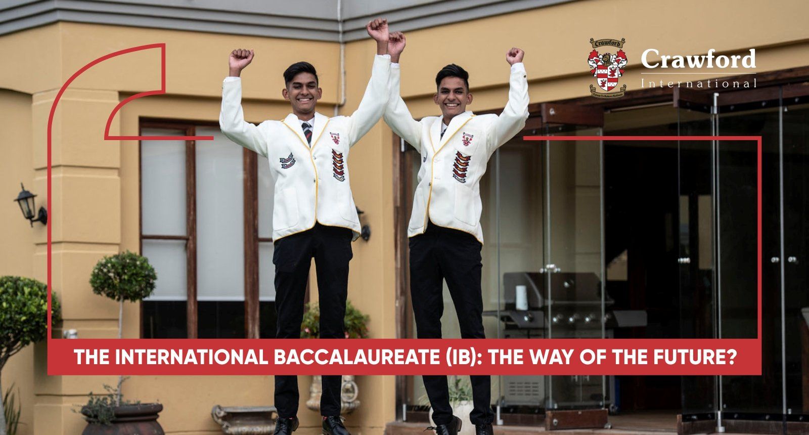Two men standing in front of a building with their arms in the air