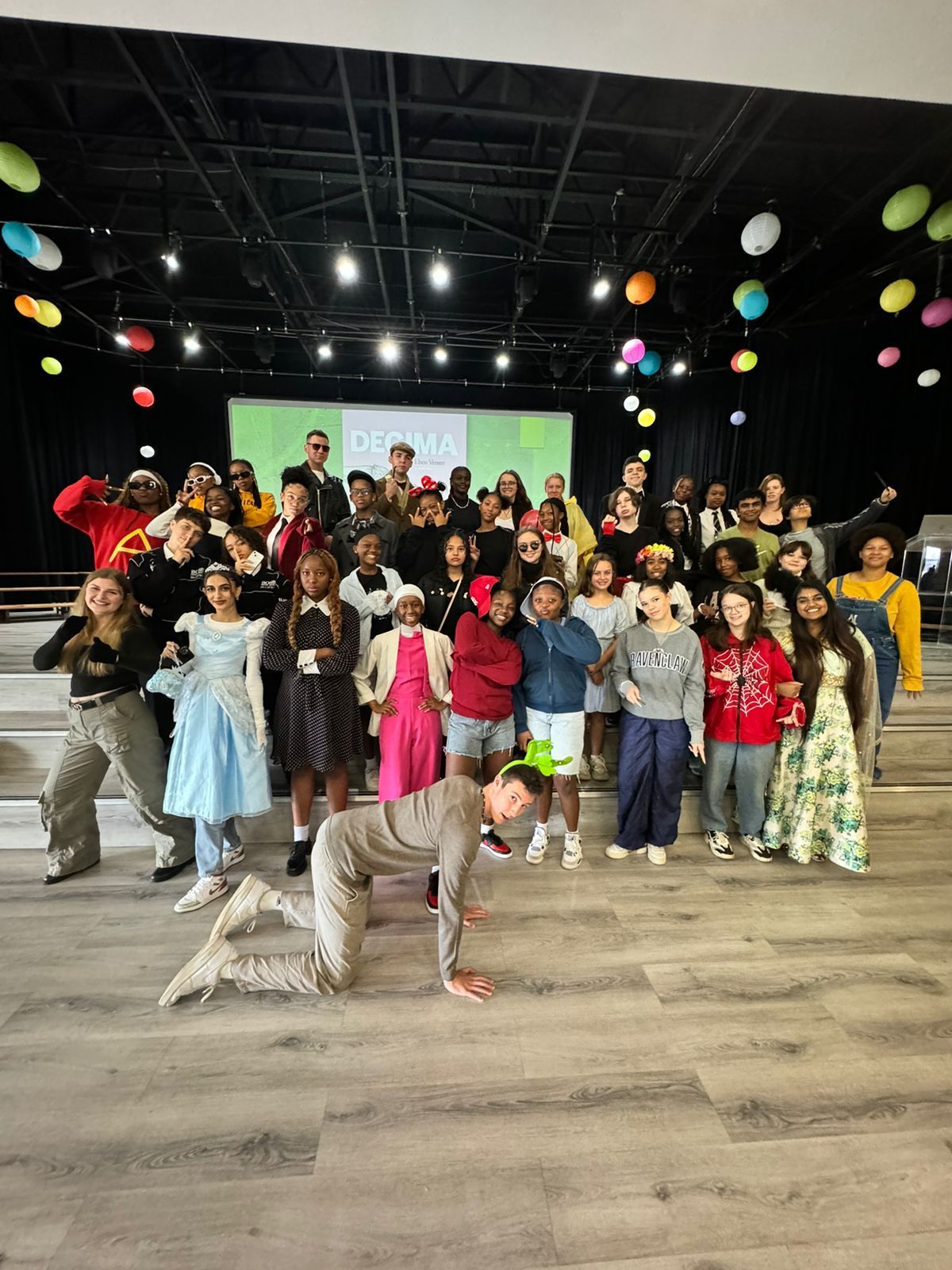 A group of people are posing for a picture in a room.