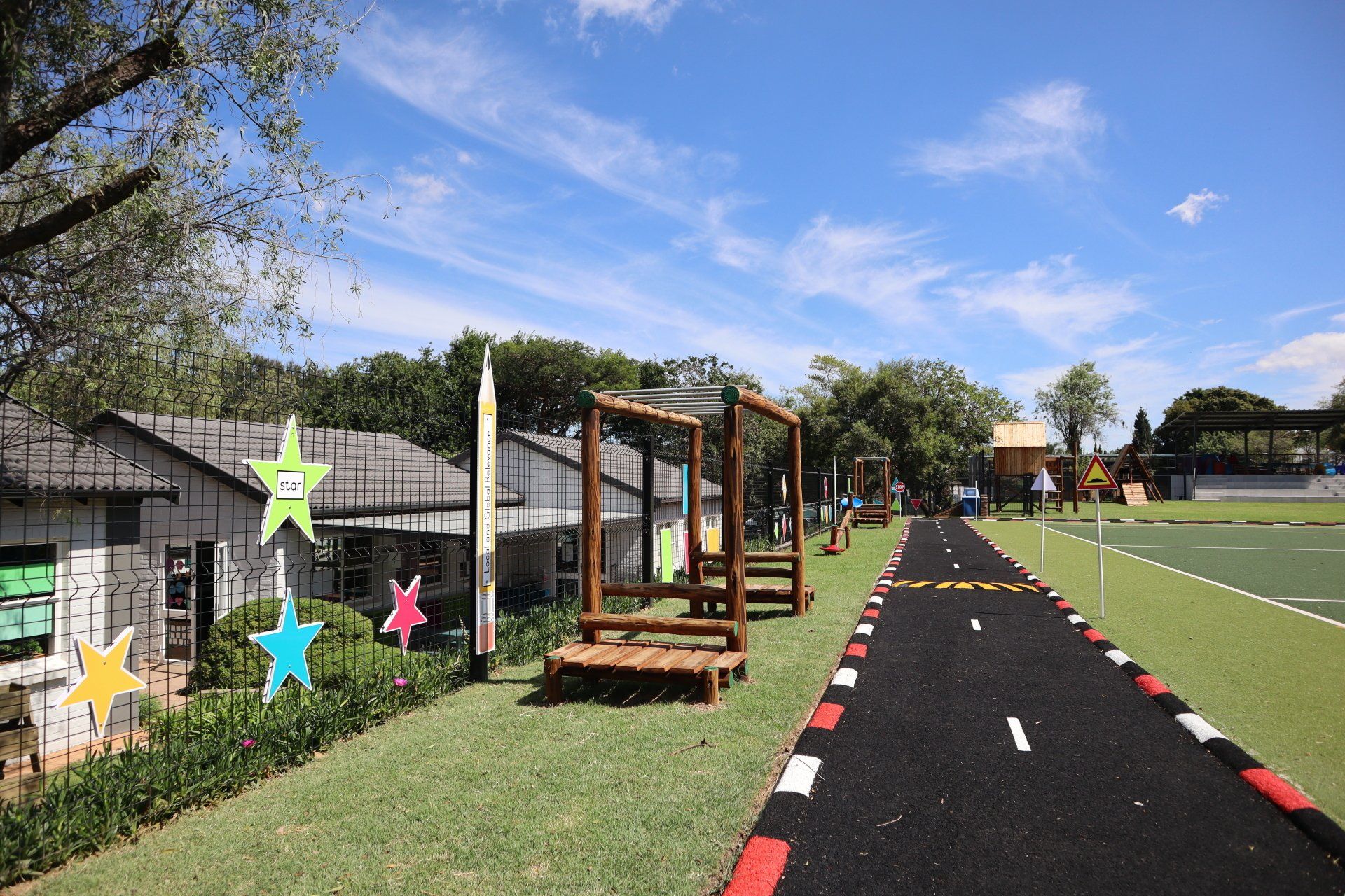 a playground with a road in the middle of it