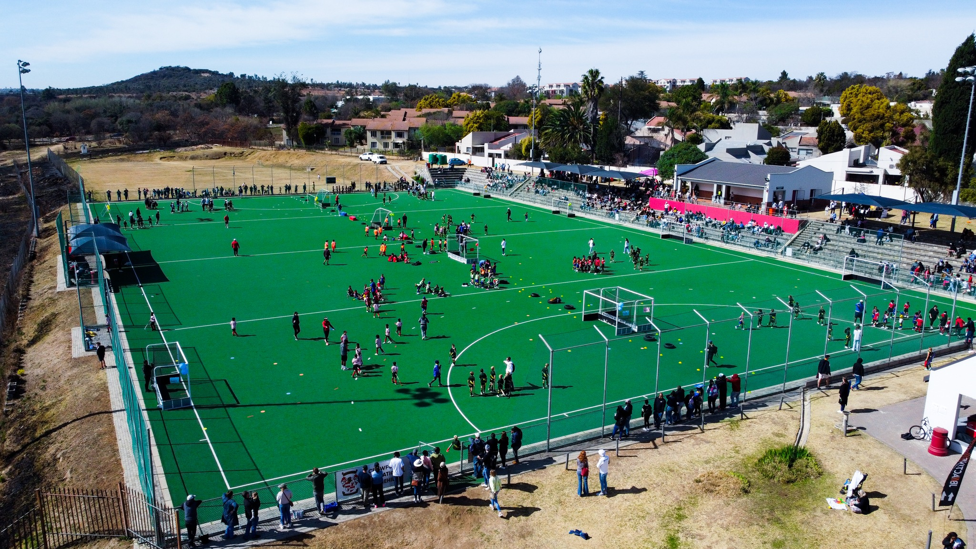An aerial view of a soccer field with people playing on it