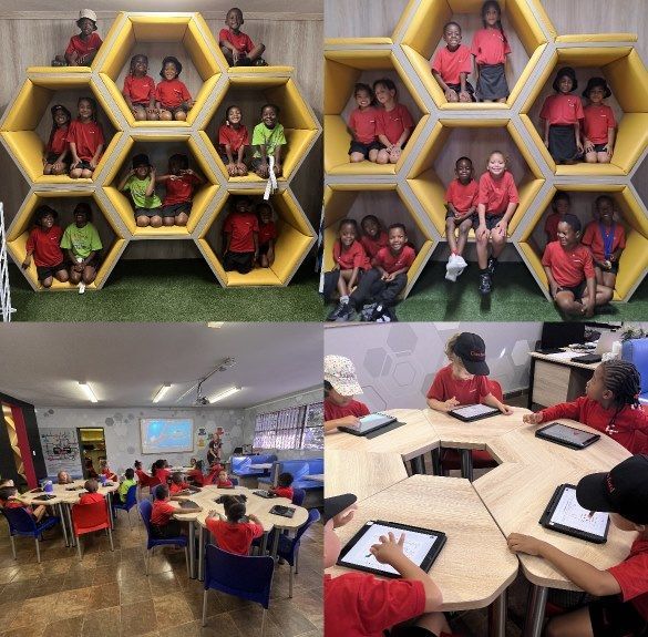 A group of children are sitting in honeycombs in a classroom