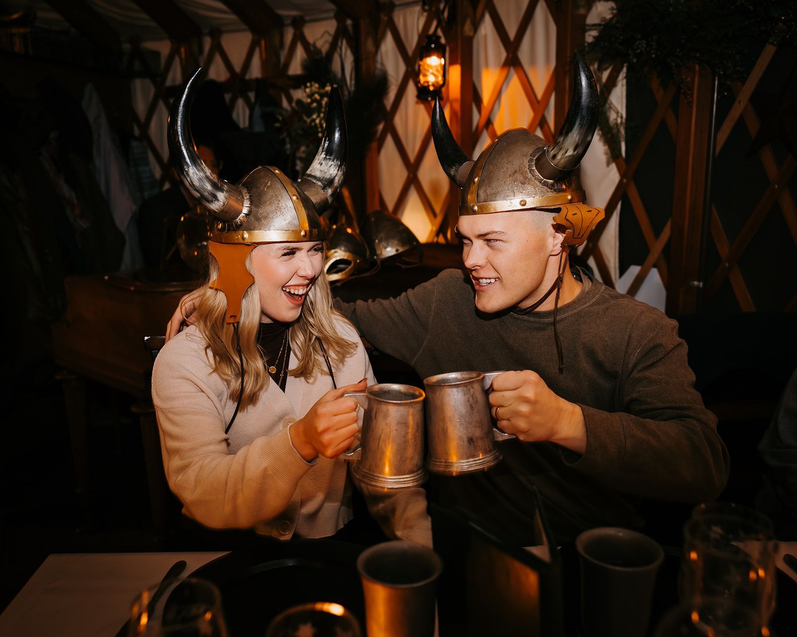 couple in viking helmets with drinks