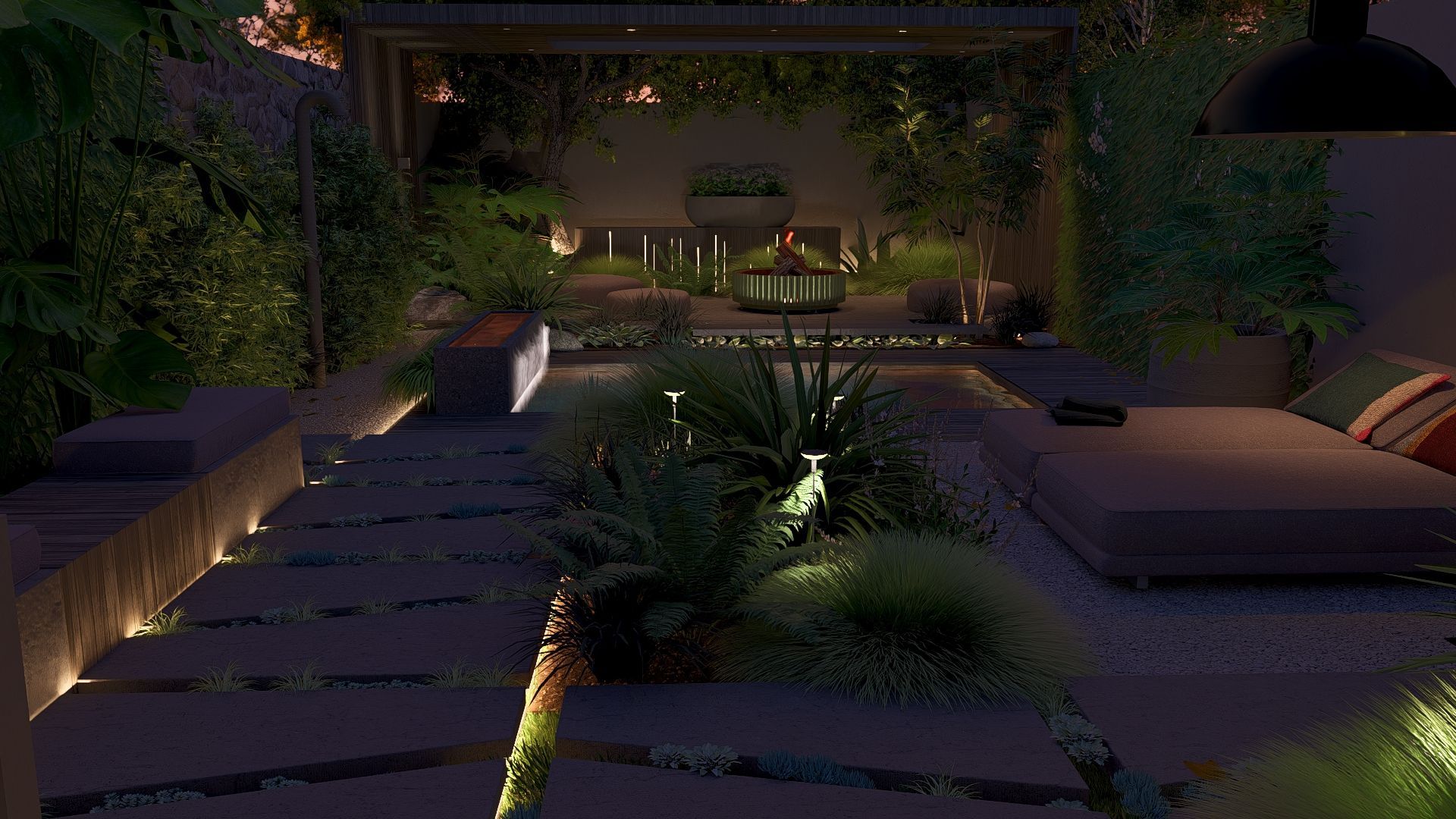 's Avonds buiten op het terras met verlichte beplanting, comfortabele zitgelegenheid en een stenen pad.