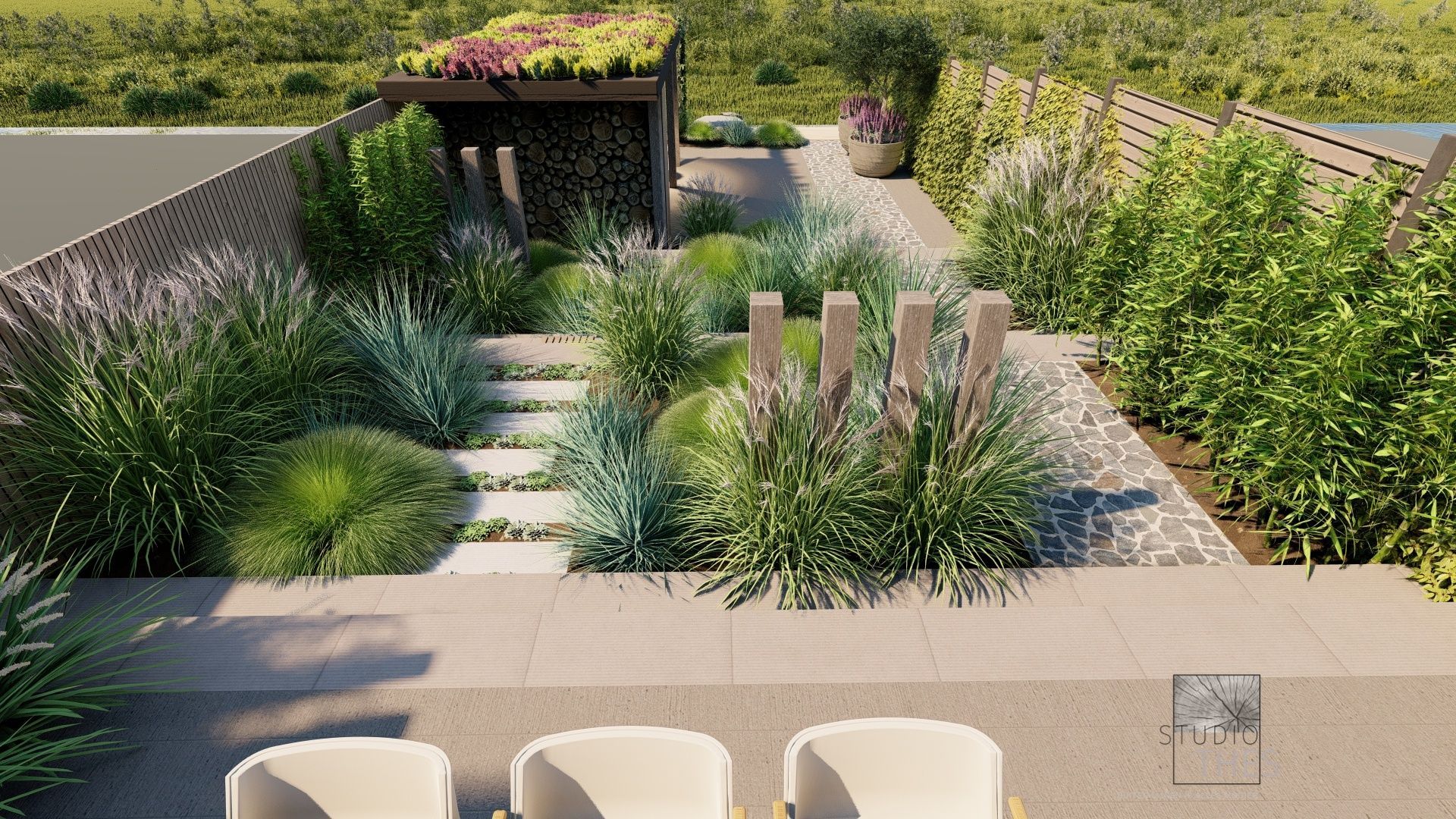 Bovenaanzicht van een moderne tuin met een pergola, stenen trappen en diverse groene planten.