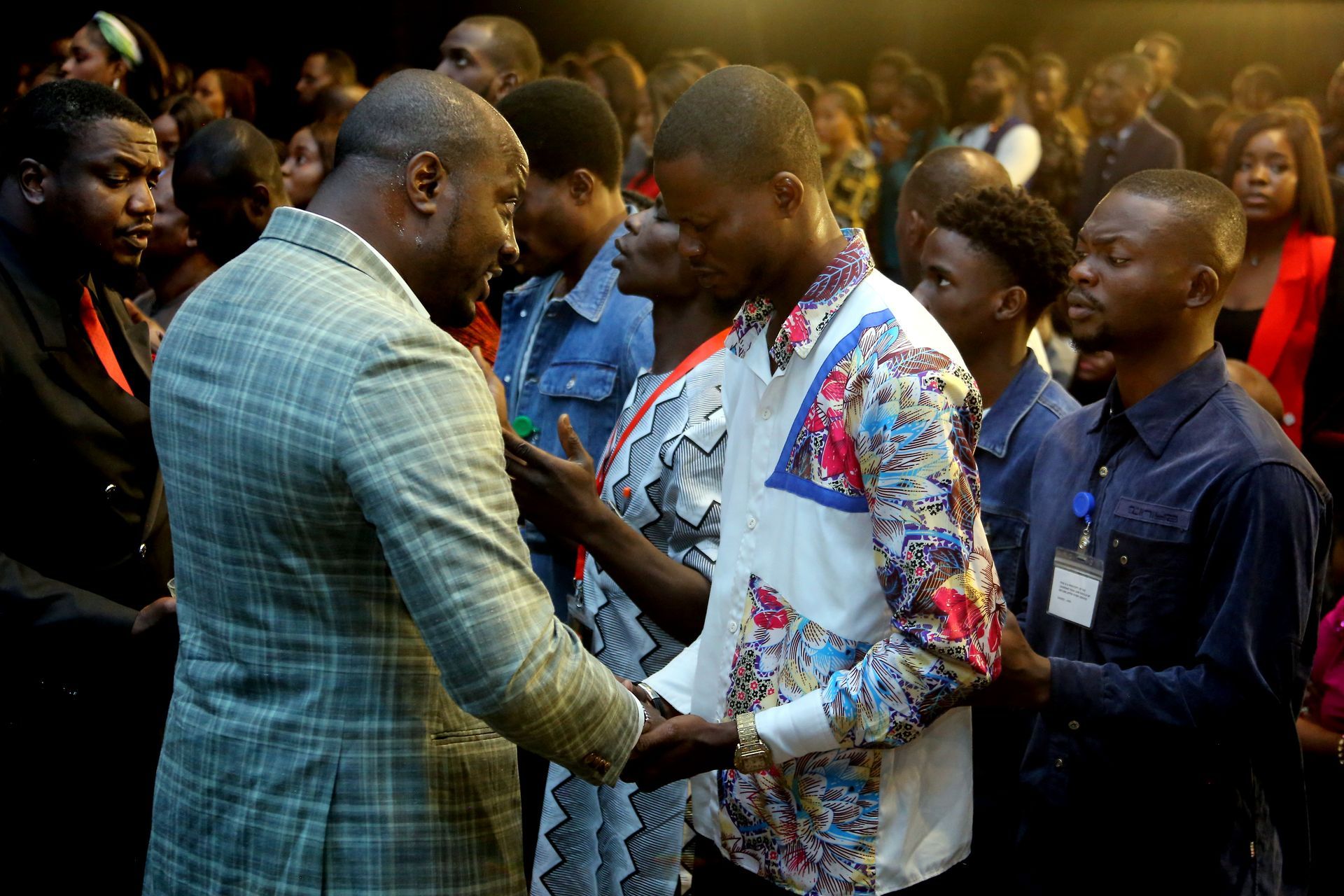 Rev William Givens ministering to a young man in Africa - Givens Family Ministry 