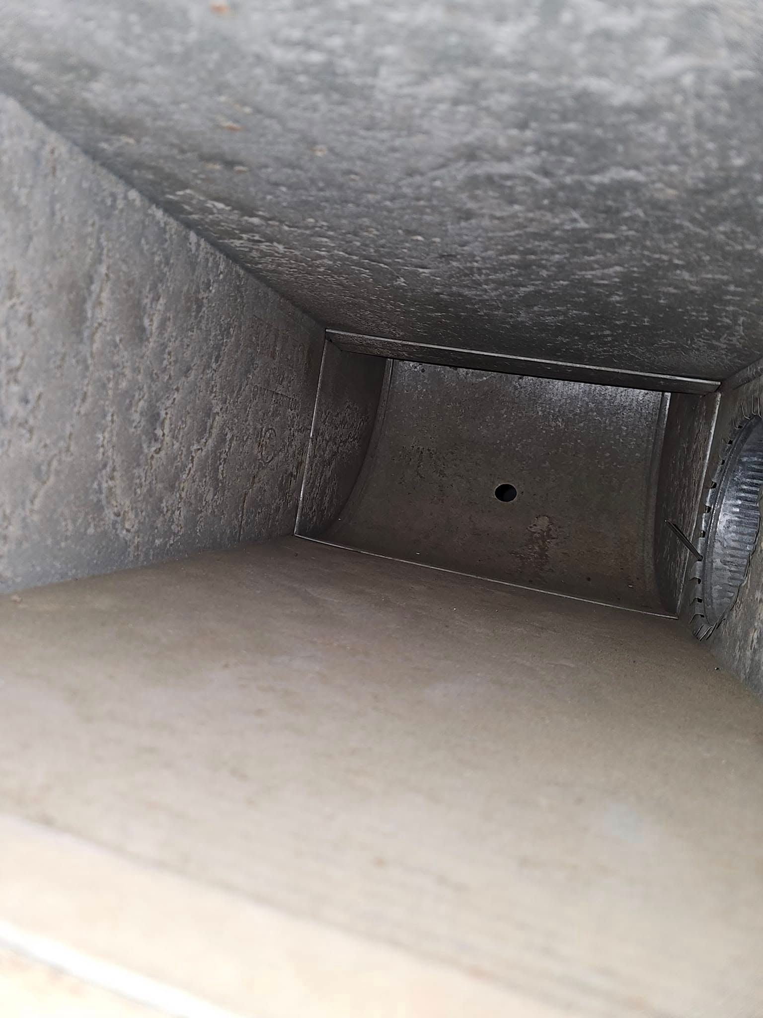 Clean air duct interior after professional air duct cleaning with visible dust removal and clear airflow path