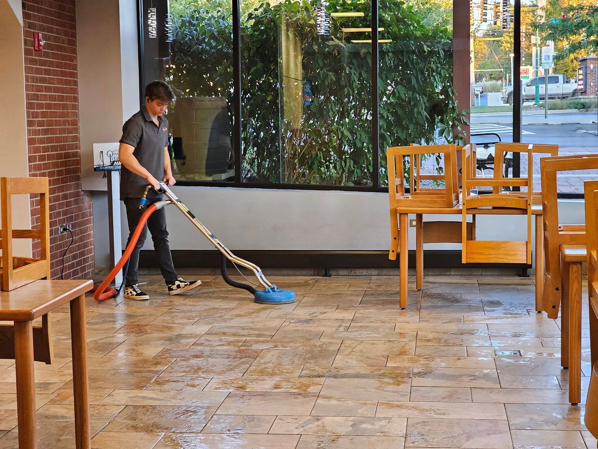 Commercial tile and grout cleaning in restaurant dining area by A Guy in a Truck