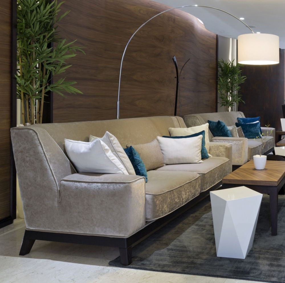 Clean commercial lounge with upholstered sofas after professional upholstery cleaning.