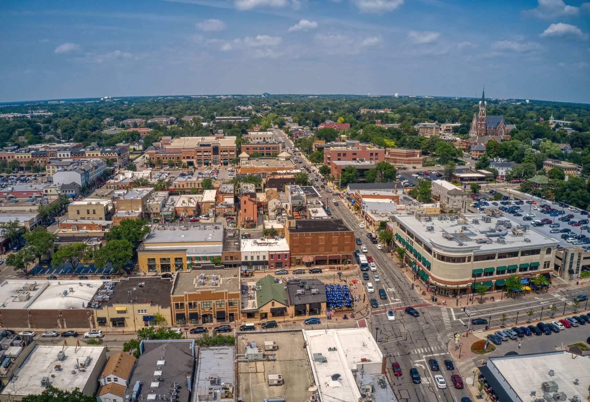 Aerial view of a downtown Illinois community with local businesses, streets, and surrounding neighborhoods