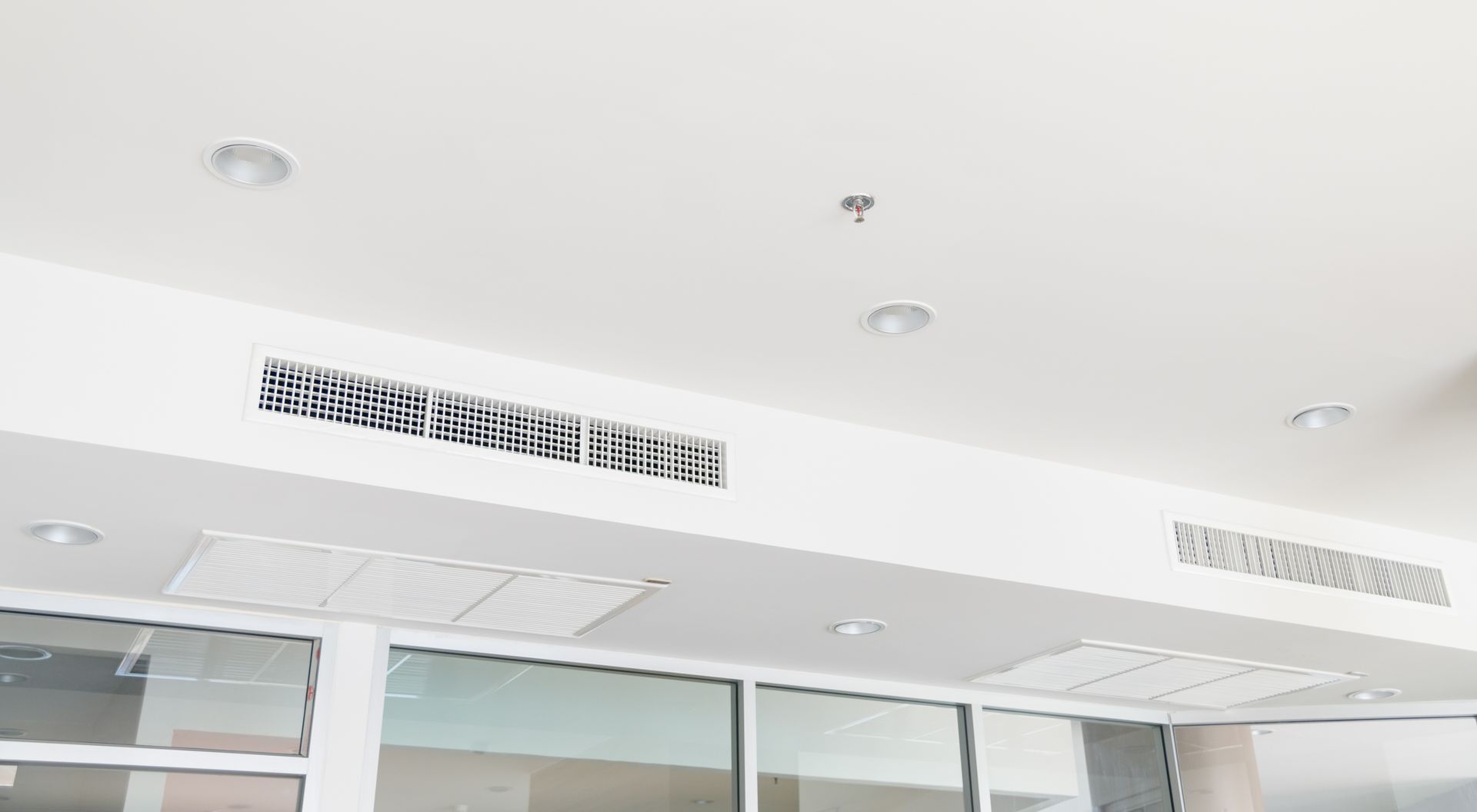 Clean ceiling air vents and diffusers after professional commercial air duct cleaning service