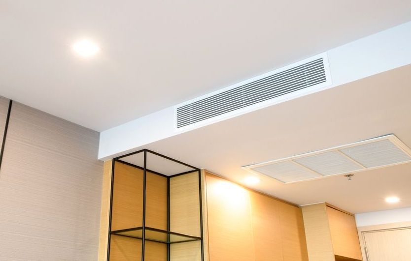 Clean air duct vent and ceiling register after professional air duct cleaning service in residential space
