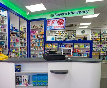 The inside of a pharmacy with a sign that says severn pharmacy