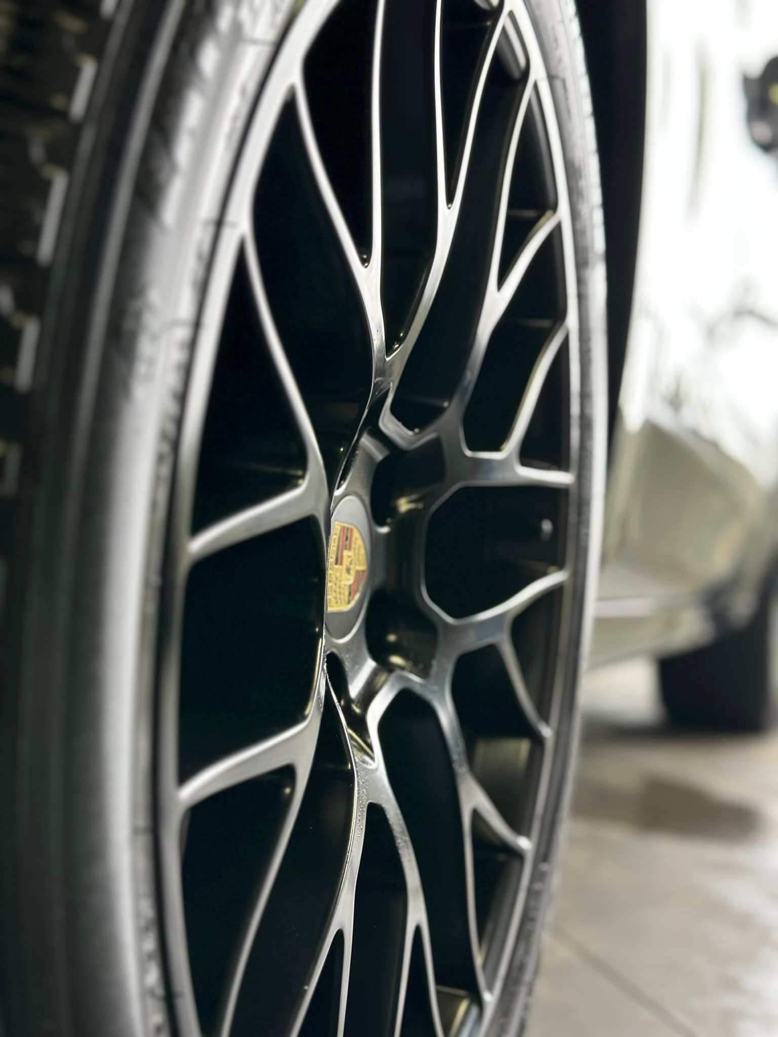 A close up of a car wheel with a tire on it.