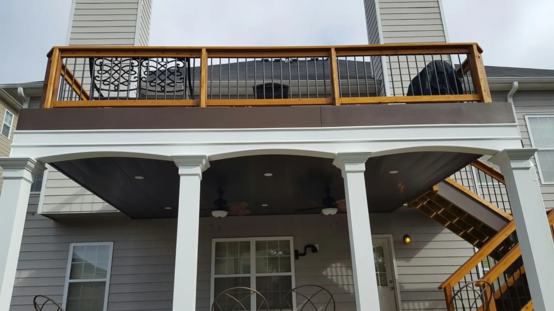 Home under deck ceiling and storage area by Maxi Decks Protection.