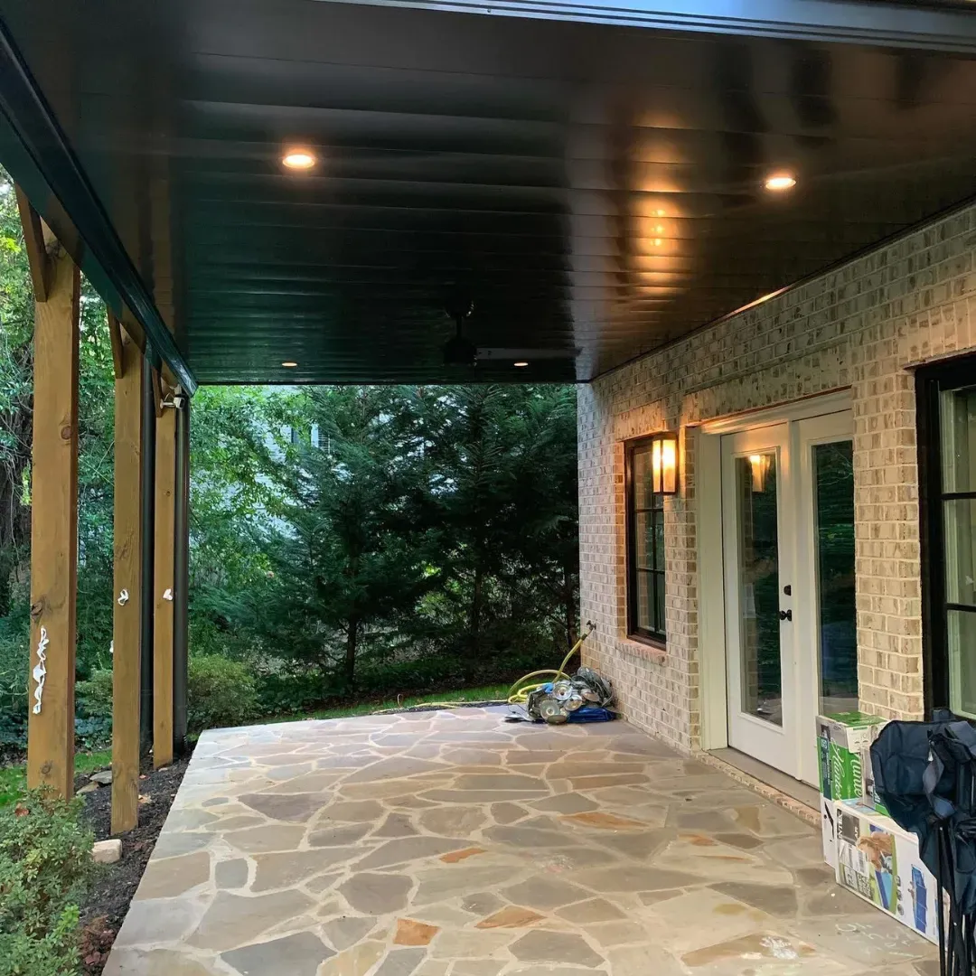 Black colored aluminum under deck ceiling installed by Maxi Decks Protection.