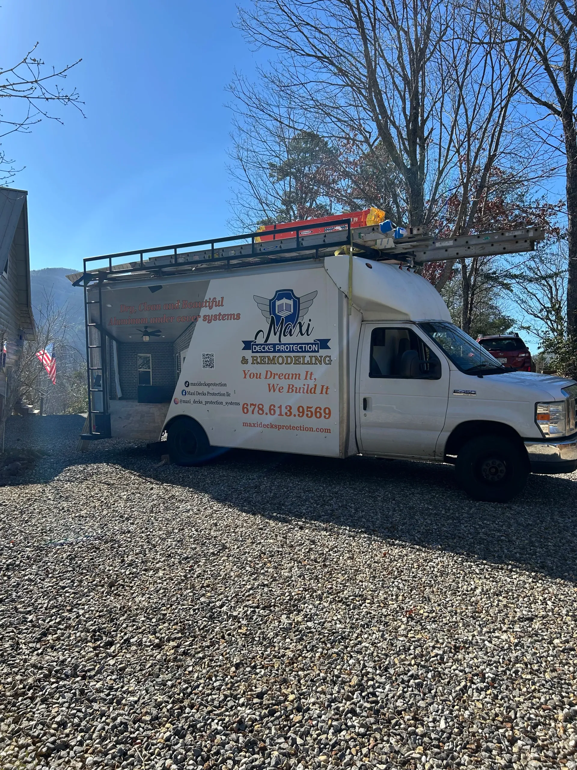 Maxi Decks Protection work truck parked at under deck ceiling installation job-site.
