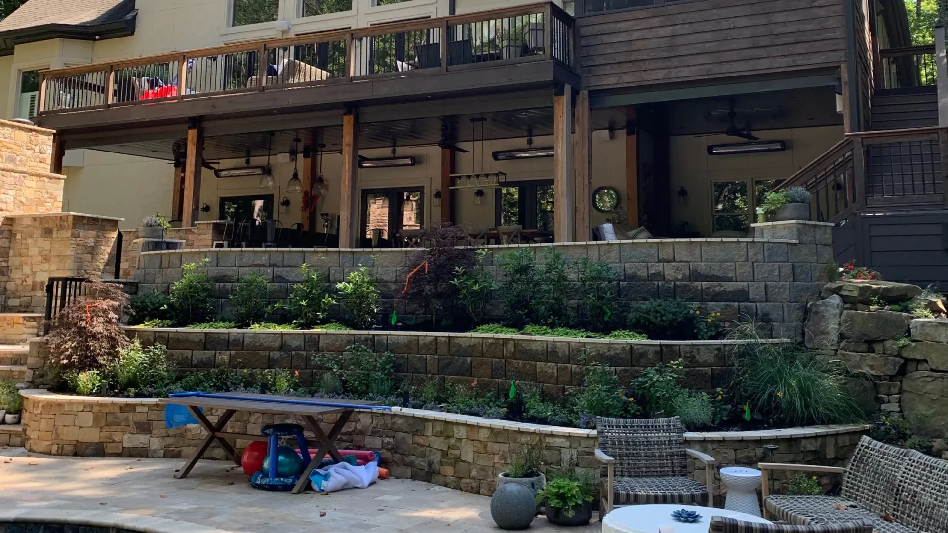 Home under deck area transformed into a garden and functional storage space.